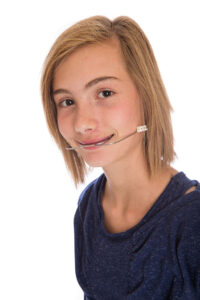 Girl with braces and headgear