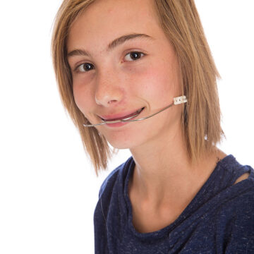 Girl with braces and headgear